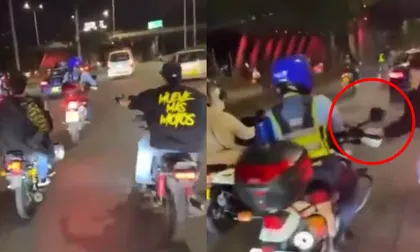 Video: agreden a agente de tránsito que intentó parar caravana de motociclistas